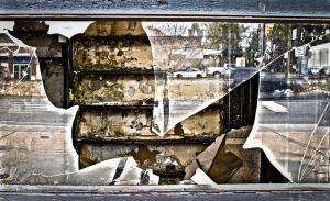 broken window reflecting traffic on street behind, Huntley Paton photo